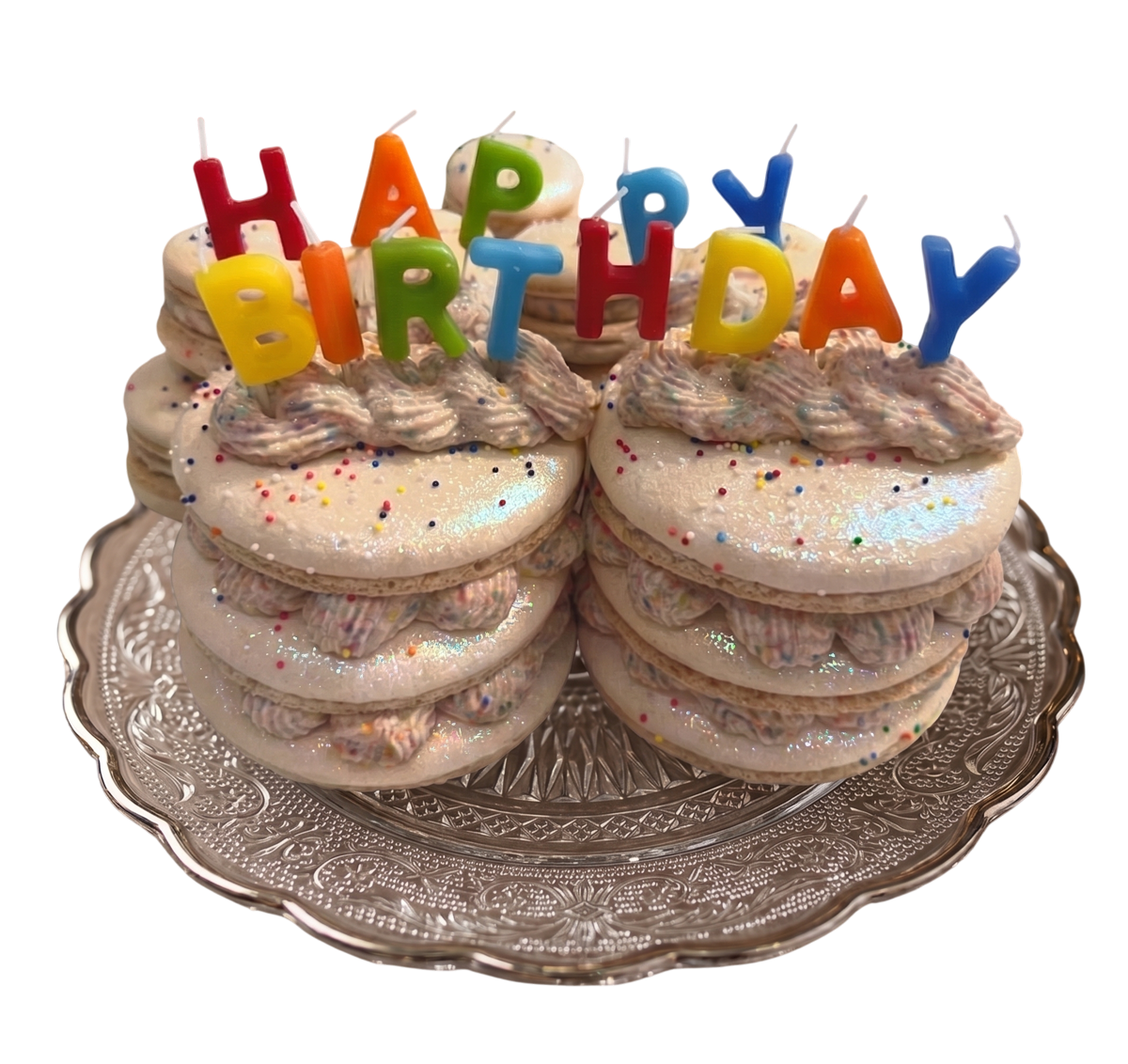 Birthday Macarons, a festive stack of cream-filled macarons topped with colorful candles and sprinkles